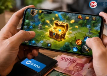Seseorang memainkan game penghasil uang di ponsel untuk mengumpulkan reward pada 2026.
